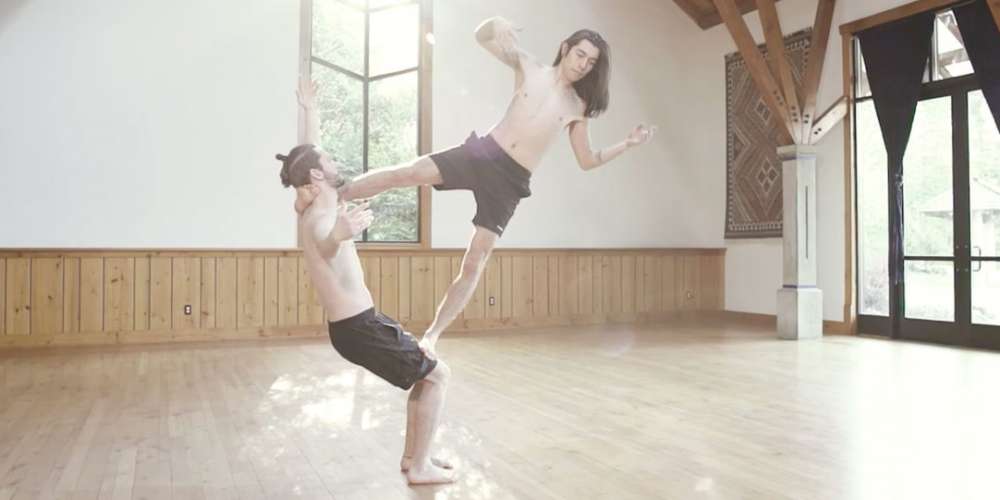 This Gay Couple’s Shirtless Acrobatic Yoga is a Sexy Metaphor for Love … or Something (Video)