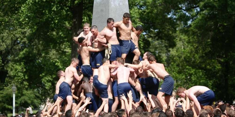 30 Homoerotic Pics of Greased-Up, Shirtless Naval Cadets Climbing a Phallus