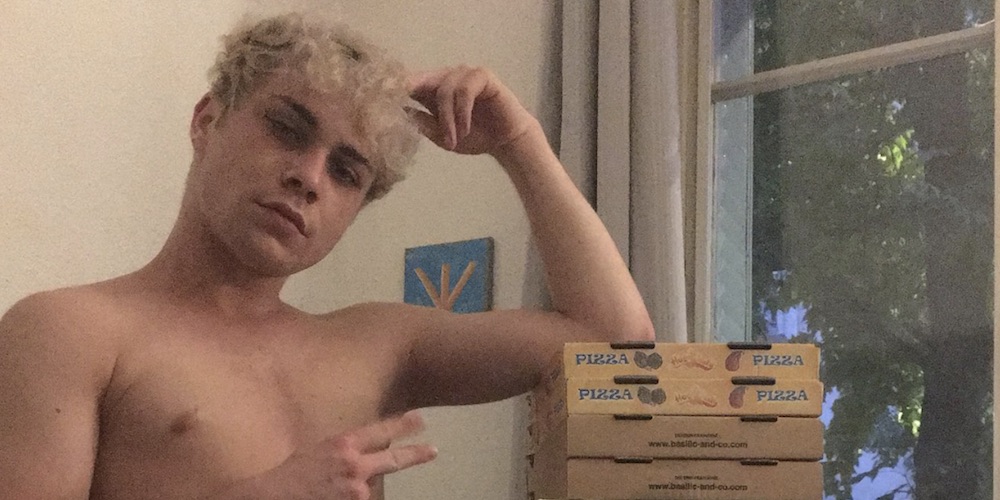 This Frequently Topless Guy Built His Own Chair Out of Pizza Boxes